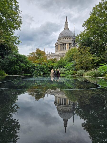 England tours from London showcasing St. Paul's Cathedral reflection in serene waters during a sightseeing taxi tour