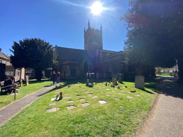 Group of tourists visiting a historic English church during a sightseeing tour with one of the best tour operators in London, featuring wheelchair-accessible vehicles and group pricing