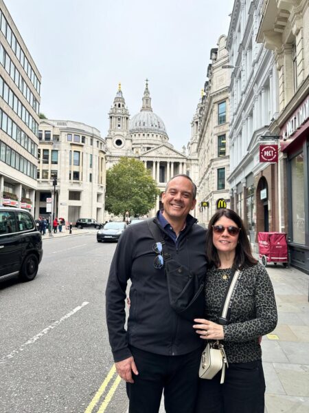 Tourists in front of St Paul's Cathedral enjoying best guided tours in London with wheelchair-accessible London Sightseeing Taxi Tours