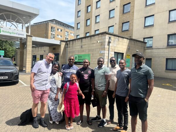 Group enjoying VIP London tour with London Sightseeing Taxi Tours, family and friends arriving for luxury private sightseeing experience in London