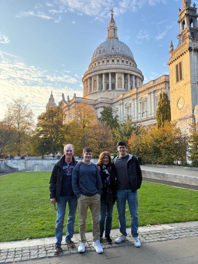 Family enjoying unique london private tours with London Sightseeing Taxi Tours at iconic St. Paul's Cathedral in autumn