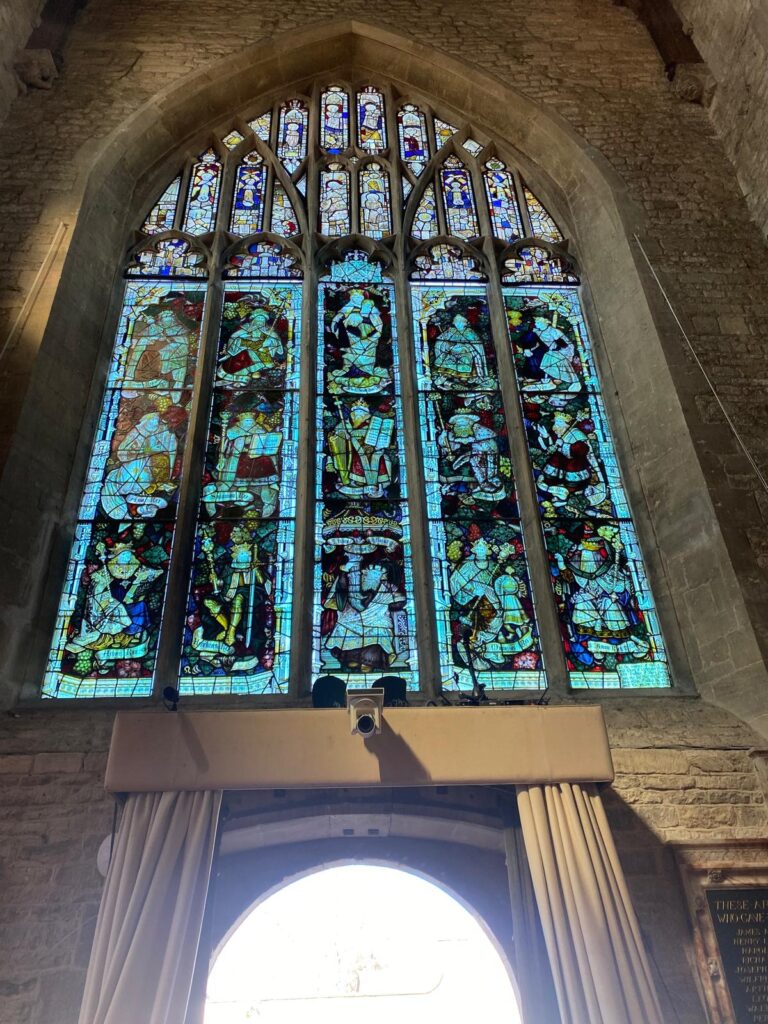 Best Westminster Abbey tour showcasing stunning stained glass windows during London sightseeing taxi tours