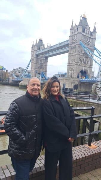 Couple enjoying best guided tours in London at iconic Tower Bridge with London Sightseeing Taxi Tours