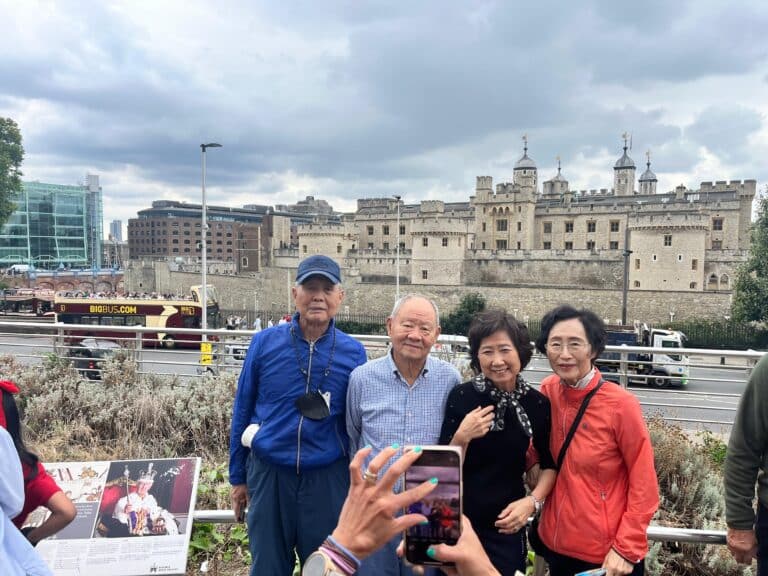 Group enjoying best excursions in London with accessible taxi tours at Tower of London