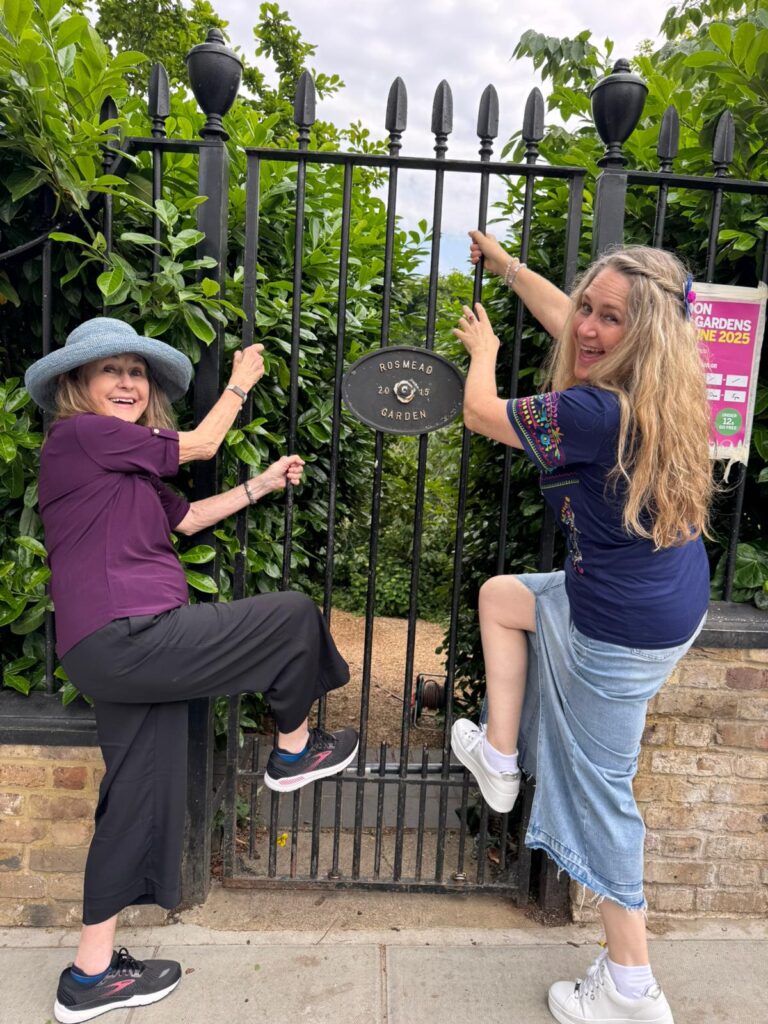 Visitors enjoying London with locals london sightseeing taxi tours at historic Kensington gate, accessible for all including wheelchair users