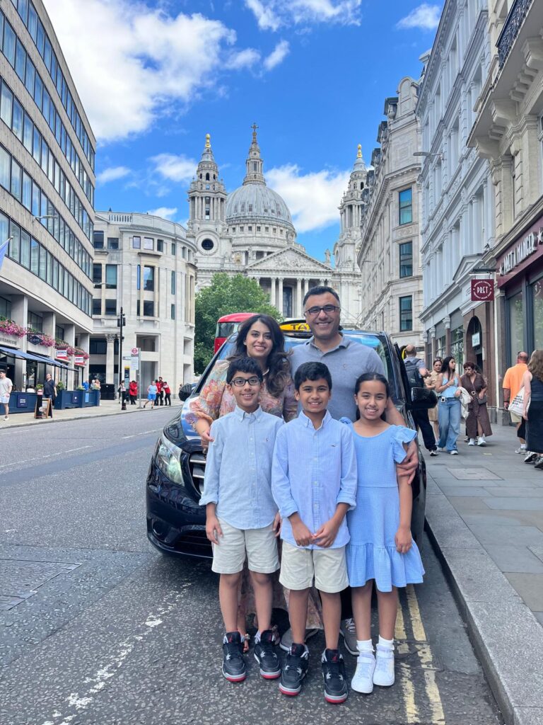 London holiday lights tour taxi with tourists enjoying the festive scenery