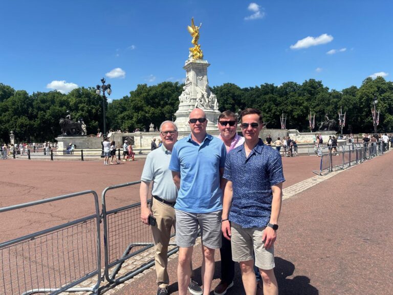 A group enjoying London Sightseeing Taxi Tours with a black cab in London