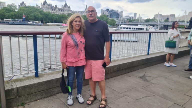 Tourists enjoying a London Sightseeing Taxi Tour in a black cab