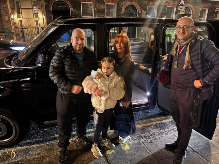 Bright London landmarks during Christmas night taxi tour, including Big Ben and Tower of London.