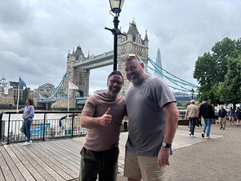 Tourists smiling in a London sightseeing taxi on a day tour