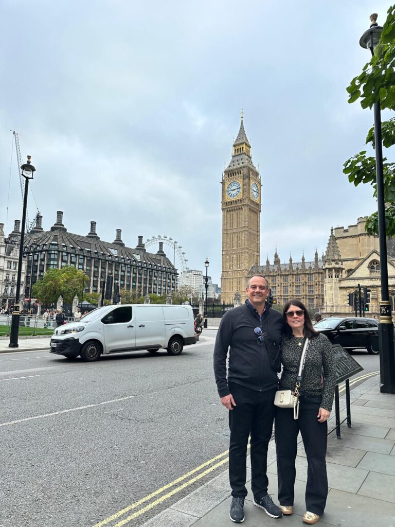 Traditional black taxi offering London UK day tours to iconic sites