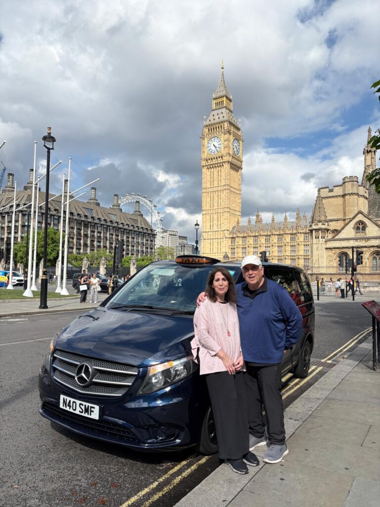 Tourists enjoying a Bath city tour with London Sightseeing Taxi