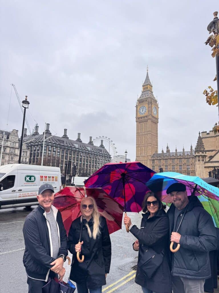 Tourists in a black taxi on London Sightseeing Taxi Tour guided by local travel guides.