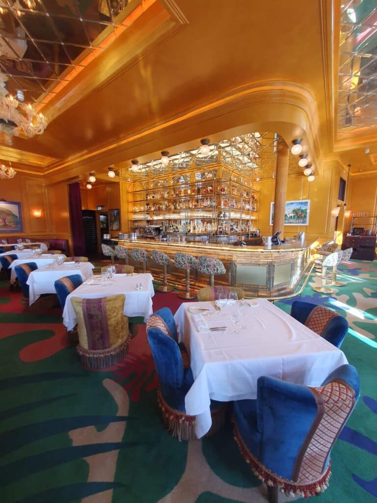 Friends taking group photos during their black cab sightseeing tour.