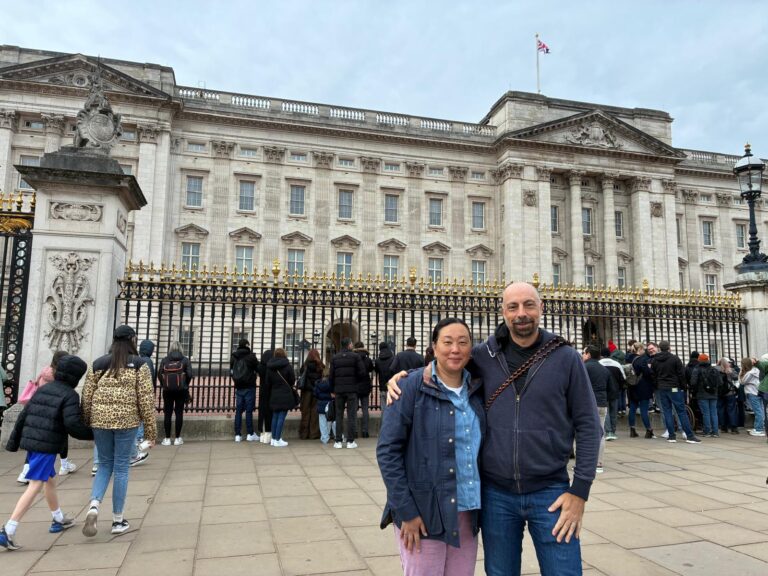 Best scenic spots for family taxi tours; family capturing photos at Tower Bridge