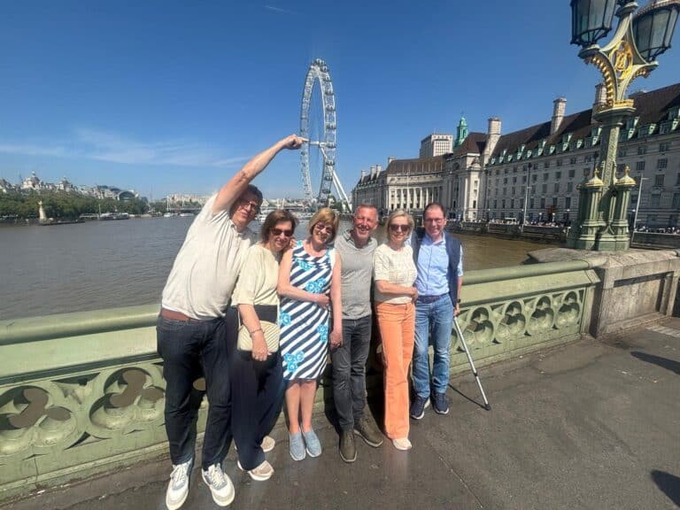 A family on a private historical landmarks black cab tour in London