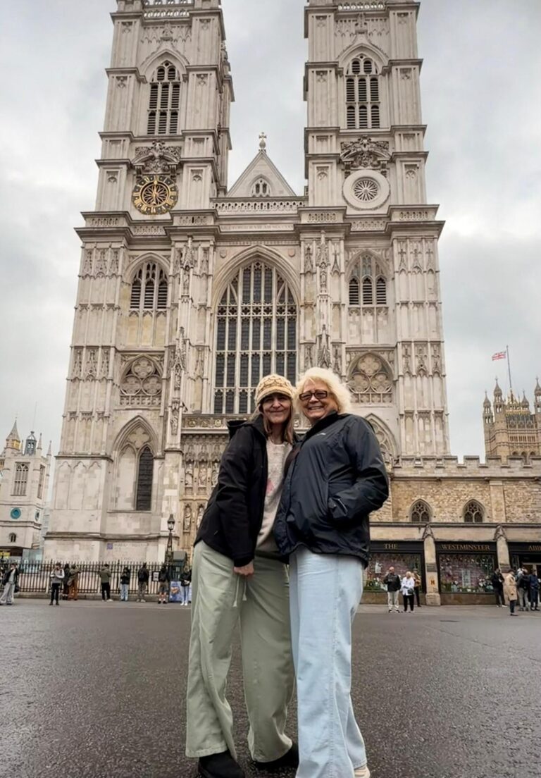 Tourists creating a customizable London taxi route during a sightseeing tour.